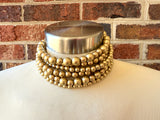 Alana 6-strand chunky choker with mixed-size matte gold beads, shown on a mannequin
