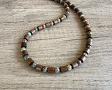DLD Jewelry's Terrance men’s necklace with brown wood beads, carved green jade beads and dark spacers.”
