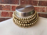 Alana 7-strand chunky choker with mixed-size matte gold beads, shown on a mannequin