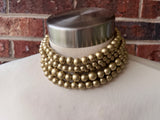 Alana 5-strand chunky choker with mixed-size matte gold beads, shown on a mannequin